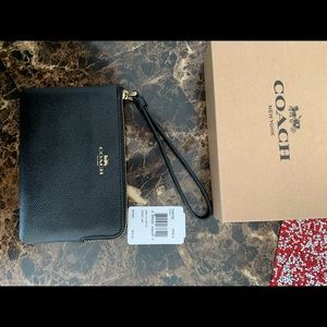 Black coach wristlet . New never used